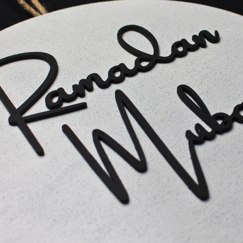 Ramadan Mubarak Wooden Sign with Stone Plaster Finish Closeup of Wooden Lettering