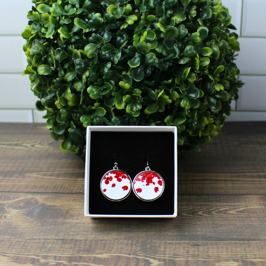 Rose Petal Print Round Stainless Steel Earrings on Display