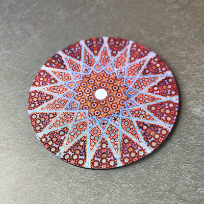 Brown geometric patterned neoprene drink coaster.