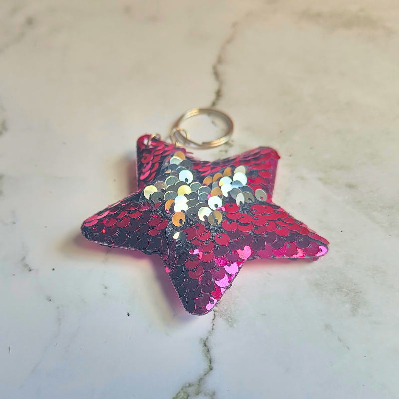 Silver and pink sensory sequin flip keyring in pink and silver.
