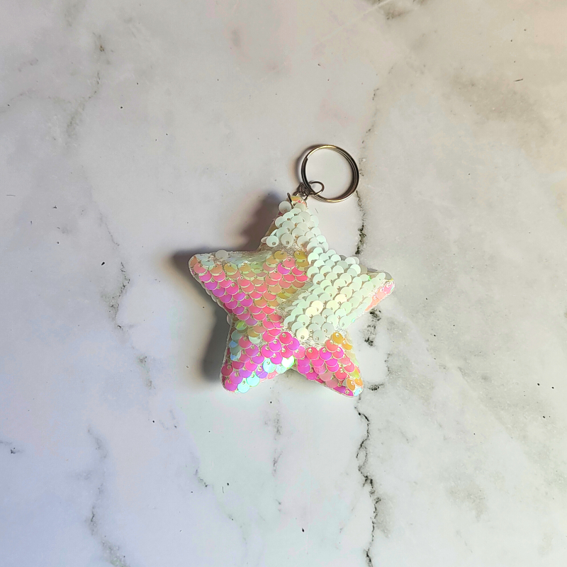 Sensory sequin flip star keyring in white and holograpic colours.