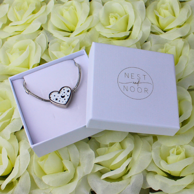 Moon and stars heart charm bracelet in gift box.