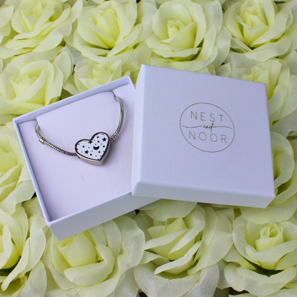 Moon and stars heart charm bracelet in gift box.