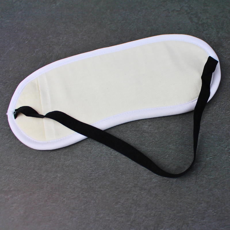Sleeping travel eye mask with elastic strap.