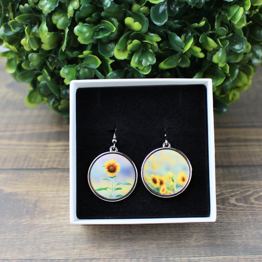 Round sunflower field stainless steel drop earrings front view