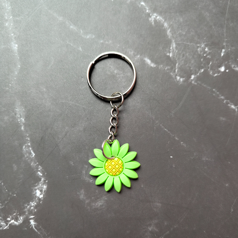Green and yellow sunflower pvc keyring.
