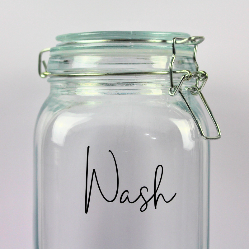 2L Glass Container with Clip Top Swing Lid - 'Wash' Label for Laundry Powder. Close up of Wash label