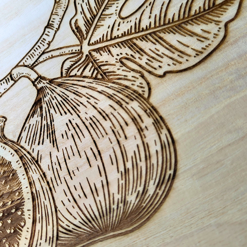 Engraved laser designed round wooden plaque with cute figs design for the modern Muslim home.