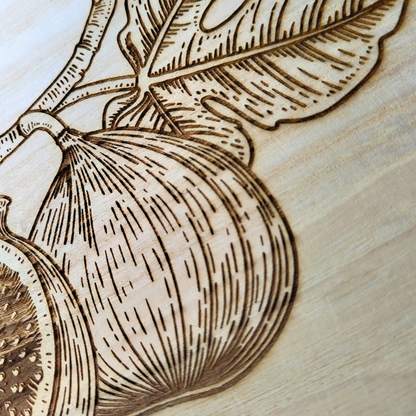 Engraved laser designed round wooden plaque with cute figs design for the modern Muslim home.