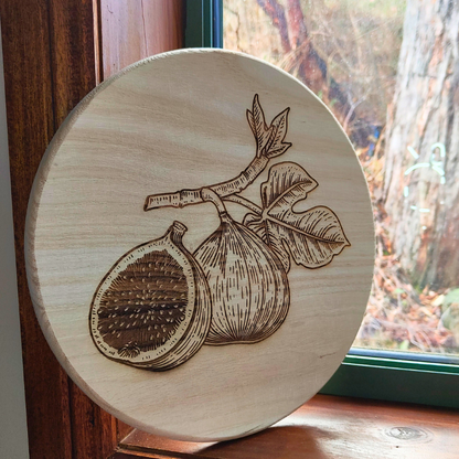 Round wooden plaque decor with laser engraved figs design. Unique Islamic home decor in Australia.
