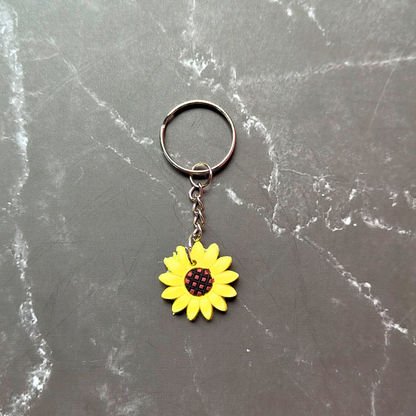 Yellow and brown sunflower keyring. Made from sturdy and durable pvc.