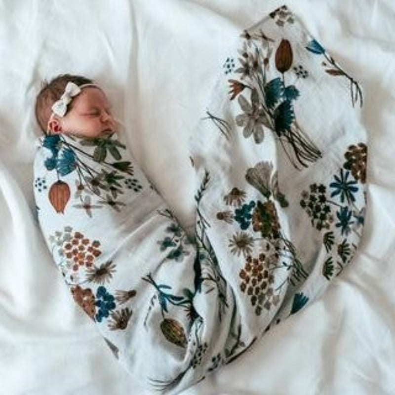 Discover our collection of gorgeous 100% organic cotton muslin swaddles that are lightweight, breathable, and machine washable. Baby swaddled in Fauna design
