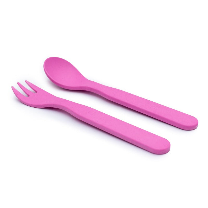 Free from melamine, and biodegradable and compostable, our plant-based spoon and fork cutlery set makes mealtimes (and sneaky snacks) way more fun! Pink cutlery set displayed on white background.