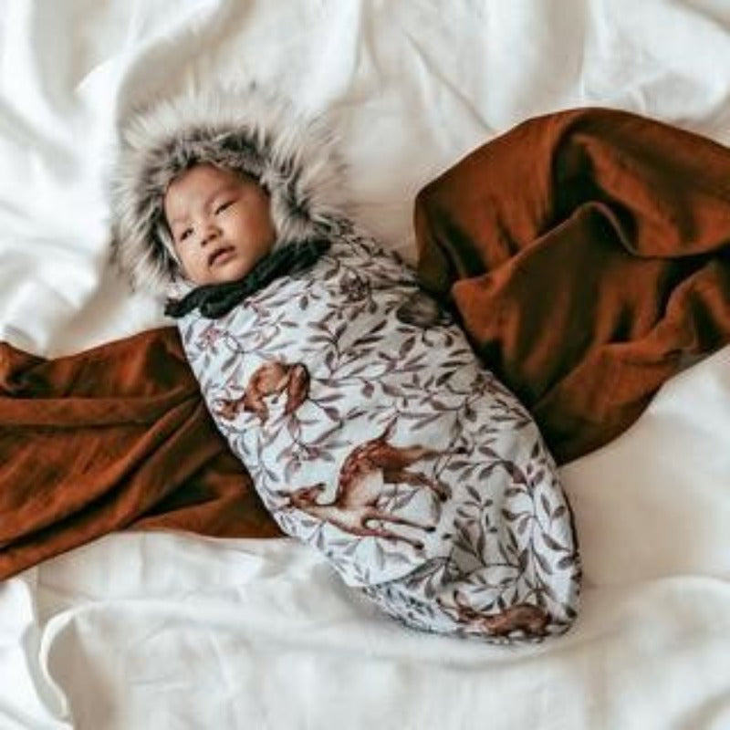 Discover our collection of gorgeous 100% organic cotton muslin swaddles that are lightweight, breathable, and machine washable. Baby swaddled in forest design