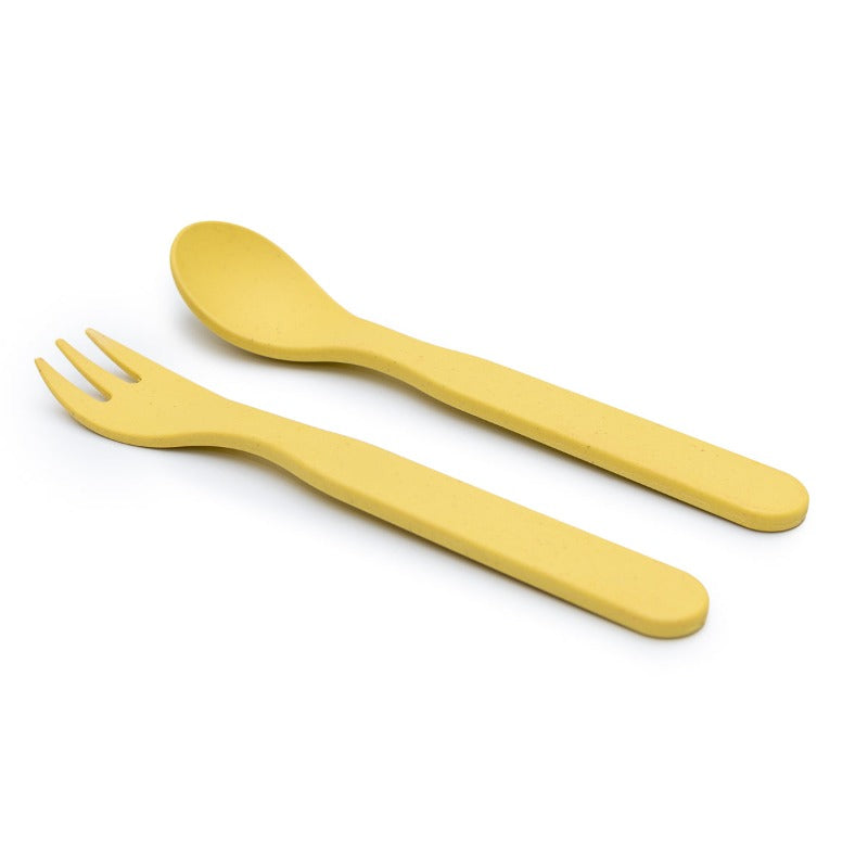 Free from melamine, and biodegradable and compostable, our plant-based spoon and fork cutlery set makes mealtimes (and sneaky snacks) way more fun! Yellow cutlery set displayed on white background.