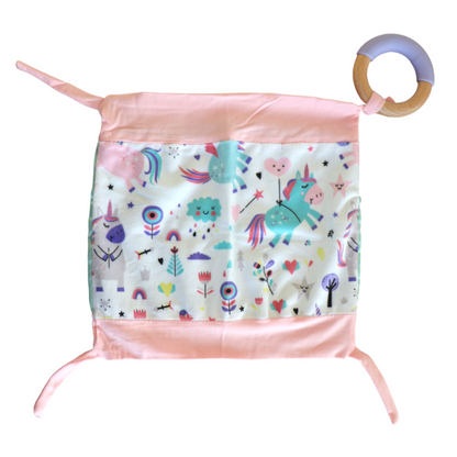 Introducing Cuddle Soother: The perfect blend of comfort and teething relief. Pink Unicorn design laid flat on a plain white background.