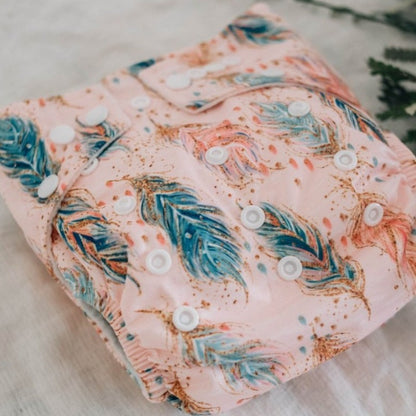 Switch to eco-friendly Modern Cloth Nappies (MCNs) for babies. Feathers and Sparkle design.