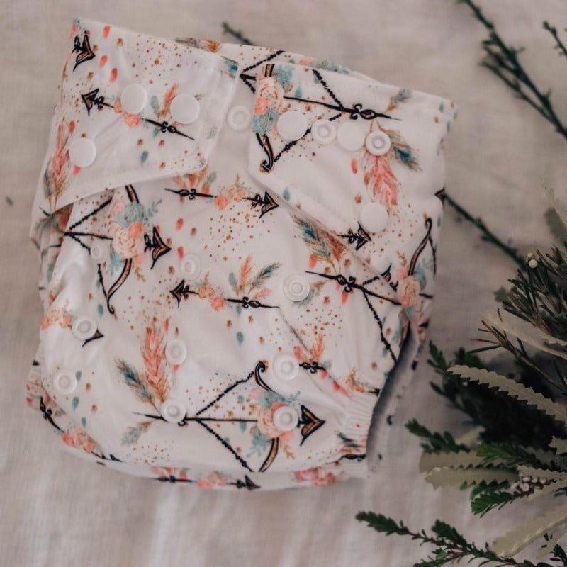 Switch to eco-friendly Modern Cloth Nappies (MCNs) for babies. Feathers and Arrows design.