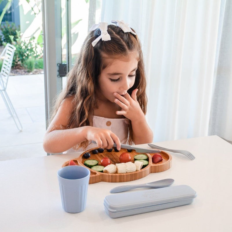Karri Koala Toddler Feeding Plate: where sustainability meets creativity.  Lifestyle image, young girl eating on the koala plate with eco cutlery and wheat cup