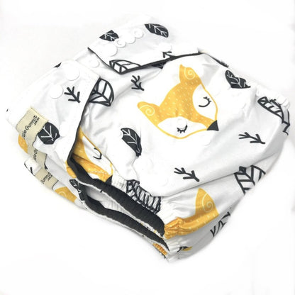 Switch to our eco-friendly modern cloth overnight nappy, featuring bamboo charcoal for superior dryness. Sleepy fox design on white background.