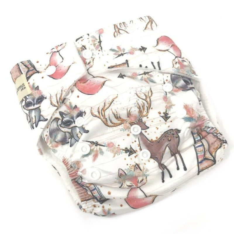 Switch to eco-friendly Modern Cloth Nappies (MCNs) for babies. Woodlands design on white background.